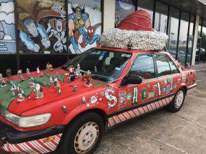 A car with decorations on the hood and top.