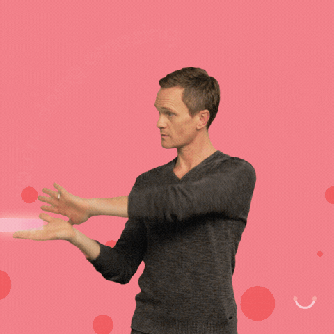 A man in black shirt throwing a frisbee.